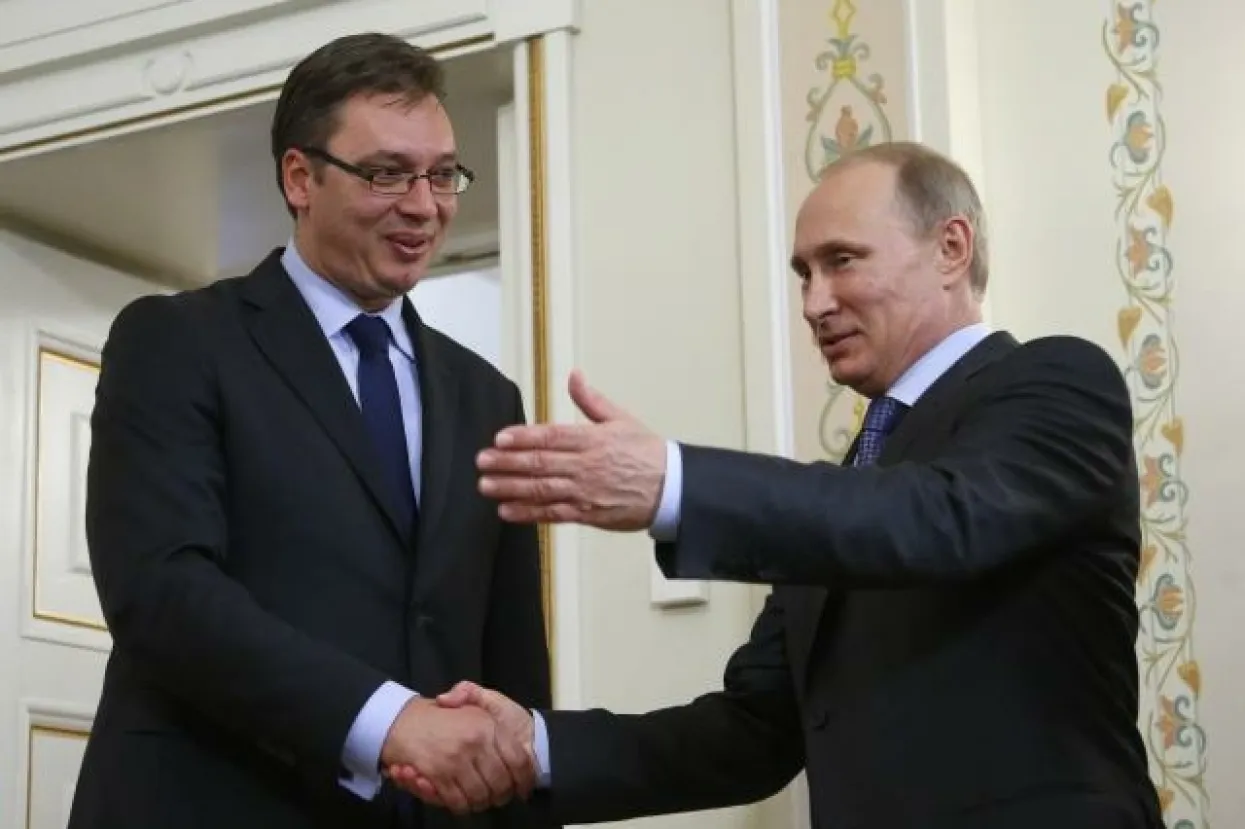 Russian President Vladimir Putin, right, shakes hands with Serbian Prime Minister Aleksandar Vucic in the Novo-Ogaryovo residence, outside Moscow, Russia, Tuesday, July 8, 2014. (AP Photo/ Max Shipenkov, pool)