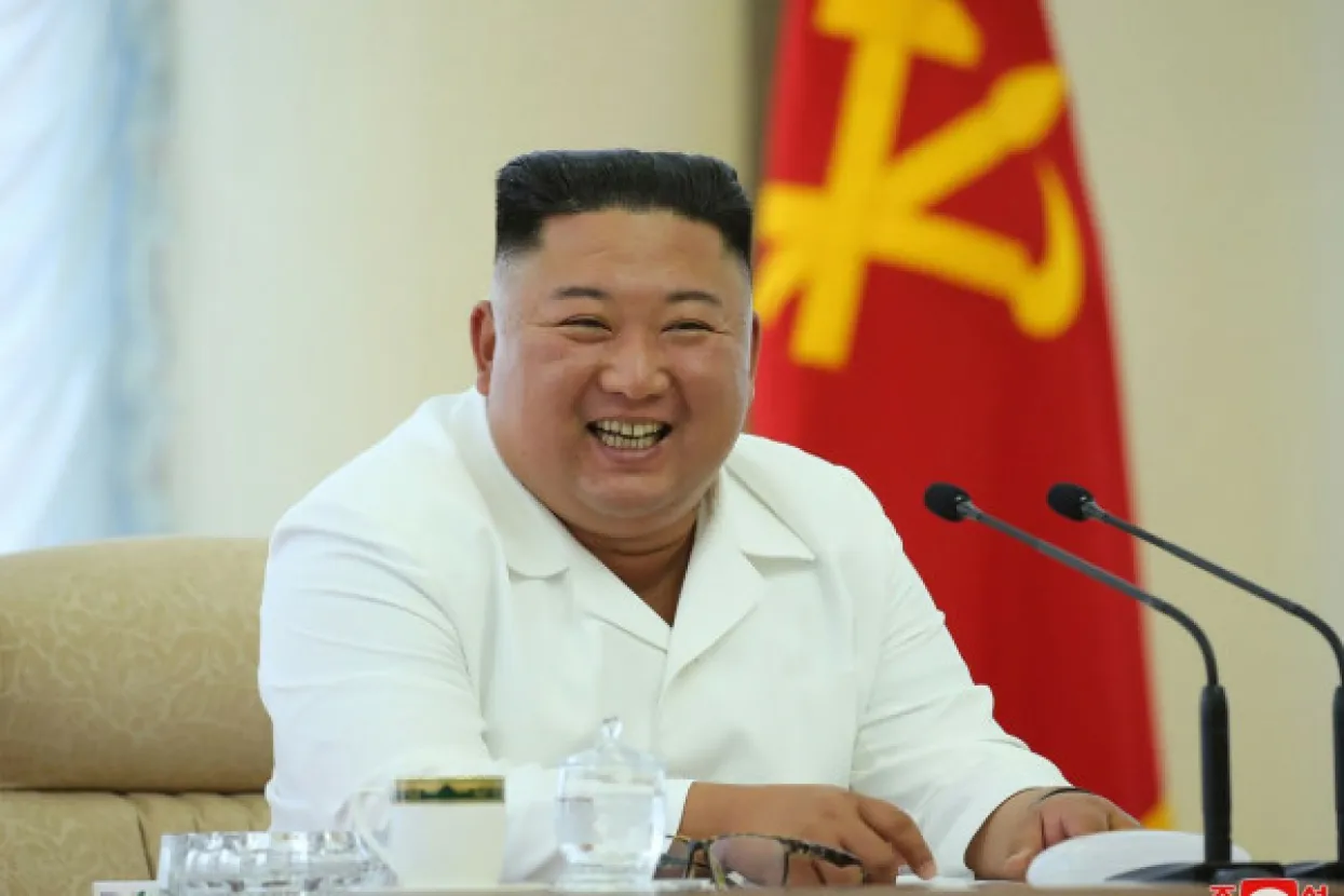 In this picture taken on June 7, 2020 and released from North Korea's official Korean Central News Agency (KCNA) on June 8, 2020 North Korean leader Kim Jong Un smiles as he attends the 13th Political Bureau meeting of the 7th Central Committee of the Workers' Party of Korea (WPK) in an undisclosed location in North Korea.,Image: 528325207, License: Rights-managed, Restrictions: South Korea OUT/---EDITORS NOTE--- RESTRICTED TO EDITORIAL USE - MANDATORY CREDIT "AFP PHOTO/KCNA VIA KNS" - NO MARKETING NO ADVERTISING CAMPAIGNS - DISTRIBUTED AS A SERVICE TO CLIENTS/THIS PICTURE WAS MADE AVAILABLE BY A THIRD PARTY. AFP CAN NOT INDEPENDENTLY VERIFY THE AUTHENTICITY, LOCATION, DATE AND CONTENT OF THIS IMAGE ---, Model Release: no